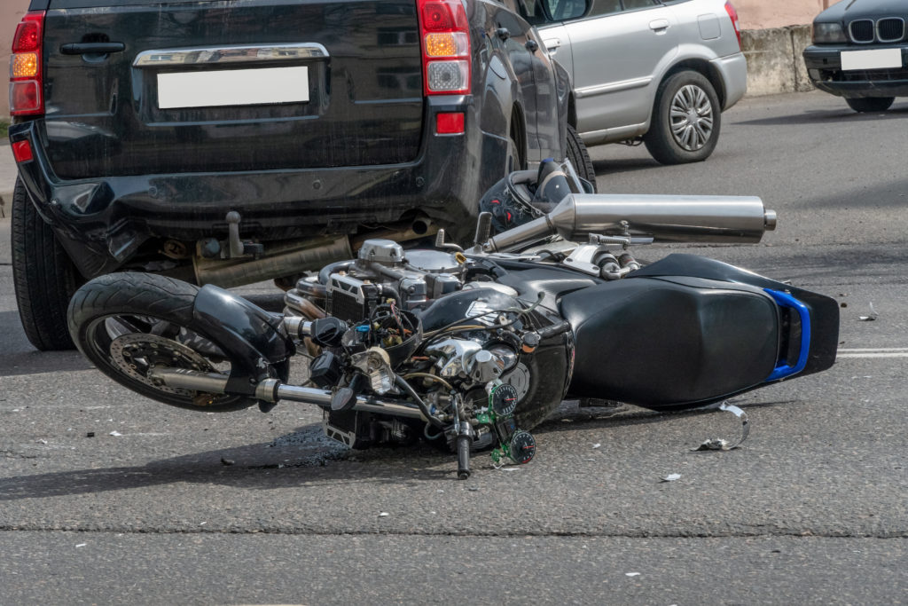 image of a motorcycle after a collision with an automobile